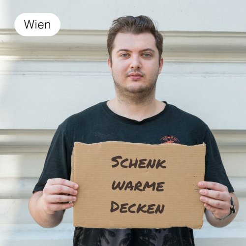 Schenk obdachlosen Menschen eine warme Decke